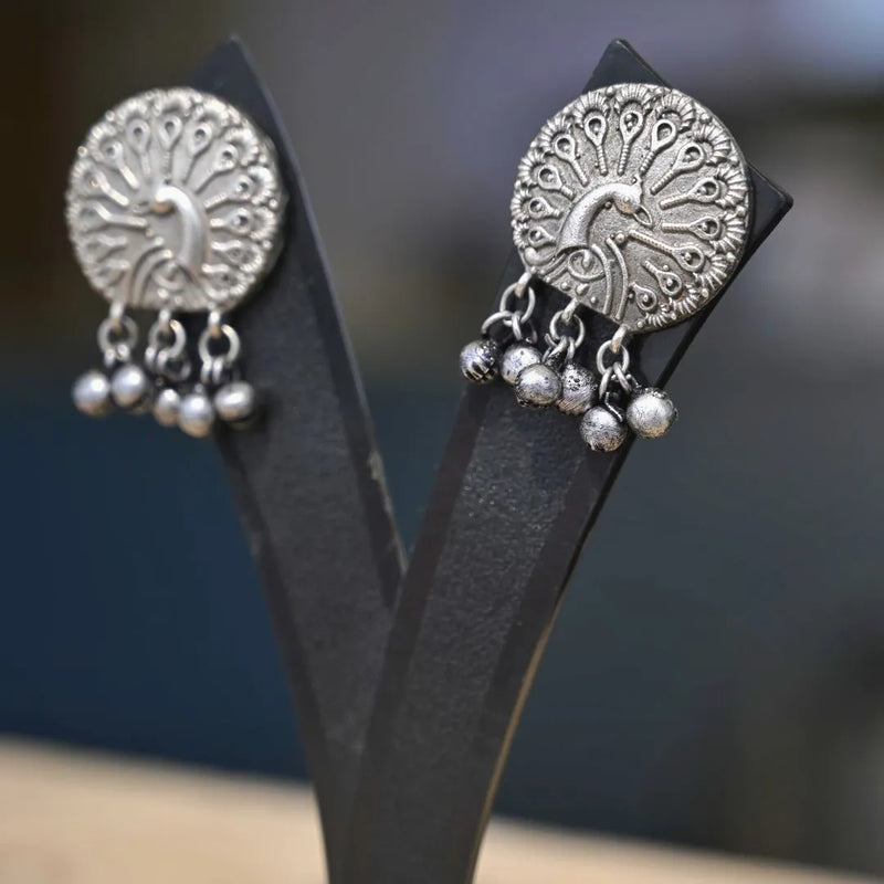 Elegant Silver-Toned Peacock Jhumka Earrings - UB Jewellerys 